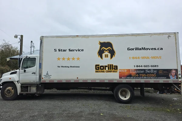 Residential movers in Maple Ridge BC loading household furniture into a moving truck